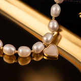 Elegant Pearl Bracelet with Gold-Tone Heart Charm