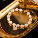 Elegant Pearl Bracelet with Gold-Tone Heart Charm