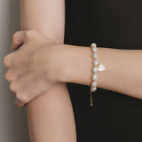 Elegant Pearl Bracelet with Gold-Tone Heart Charm