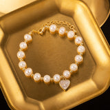 Elegant Pearl Bracelet with Gold-Tone Heart Charm